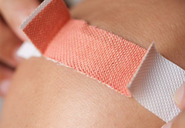 putting a bandage on